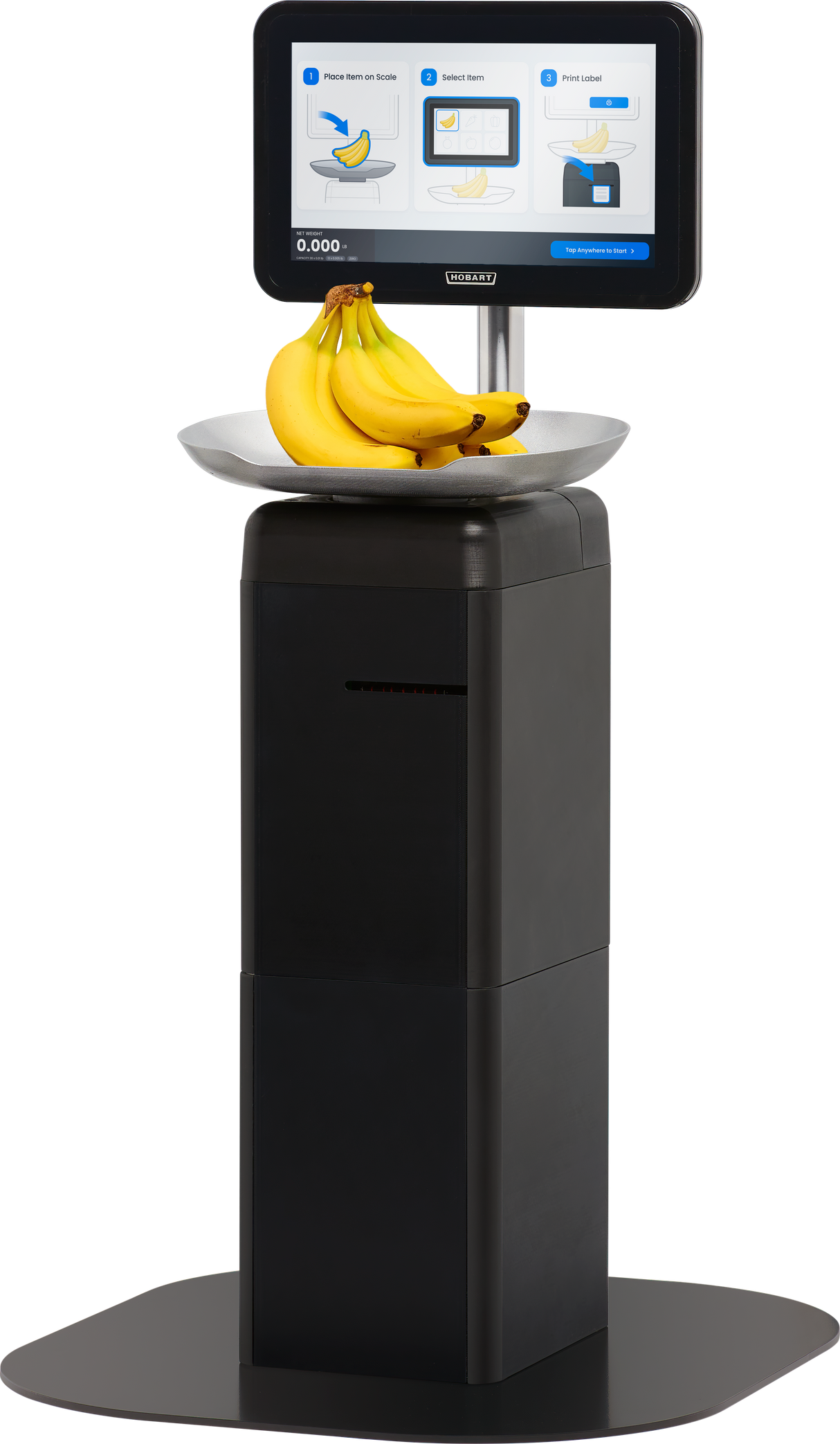 A self-service checkout kiosk features a touchscreen scale with weighing instructions and an image of bananas. A bunch of bananas sits on the silver platform beneath the display. The black Hobart FS-200 stands on a flat base.