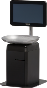 A modern self-serve scale checkout machine with a large touchscreen on a vertical pole above a silver weighing tray and a black rectangular base, designed for use in supermarkets or retail stores.