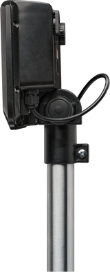 A close-up side view of a black electronic device, possibly part of a bench receiving scale with 300 lb capacity, mounted on a silver pole. A thick black cable loops from the device. The background is a plain light gray.