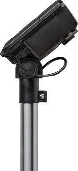 A black security camera is mounted on top of a cylindrical metal pole, similar to those found in areas with a bench receiving scale, 300 lb capacity, legal for trade. A loose cable loops below the camera, which is angled downward and securely attached.