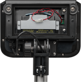 Close-up of the back of a bench receiving scale, cover removed to show exposed wires, battery compartment, and metal mounting bracket. Red and black wires connect to a gray battery, with a warning label inside the 300 lb capacity compartment.