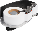 A close-up of an HTi Scale white label printer cartridge with a large roll of blank white labels inside a black and gray plastic holder, exposing the internal mechanisms, Auto Cutter, rollers, and metallic parts used to feed and cut the labels.