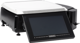 A black and silver Hobart HTi scale/printer with a large stainless steel weighing platform and an angled digital touchscreen display panel sits on a white background, featuring a sleek 7 customer display. No weight or figures are visible.