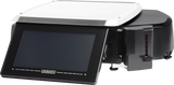 A modern Hobart HTi Scale with a large touchscreen display, stainless steel weighing platform, and side-mounted label printer with Auto Cutter. The device is black with silver accents and features an angular, compact design for retail or food service settings.
