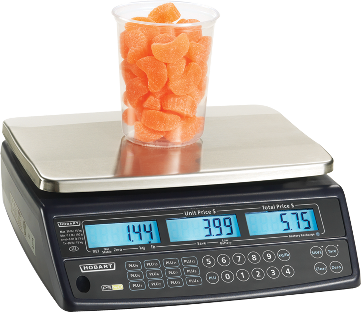 A Price Computing Scale with a 30 lb capacity displays 1.44 kg of orange gummy candies in a clear plastic cup. The unit price is $3.99, total $5.75, and the front panel’s buttons and digital screens are clearly visible, legal for trade use.