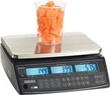 A Price Computing Scale with a 30 lb capacity displays 1.44 kg of orange gummy candies in a clear plastic cup. The unit price is $3.99, total $5.75, and the front panel’s buttons and digital screens are clearly visible, legal for trade use.
