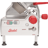 A silver Berkel gravity feed slicer with red handles and knobs. The control panel features “Blade Power,” “Automatic,” and “Manual.” It stands on four black-tipped legs, features a 12 carbon steel knife, and has the red Berkel logo on the front.