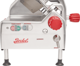 A close-up of a Berkel automatic slicer featuring a 12 carbon steel knife, a red power dial, silver lever labeled automatic/manual, indicator lights, and visible blade area. The machine stands on four legs with rubber feet and has a logo on the front.