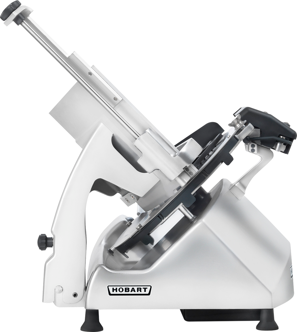A silver Hobart Meat Slicer is shown in profile. This heavy duty meat slicer features a large 13 CleanCut Knife, angled food carriage, black adjustment knobs, and rubber feet for stability. The Hobart logo is visible on the base against a plain light gray background.