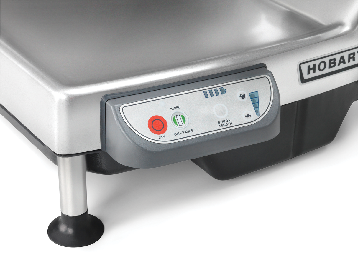 Close-up of a stainless steel Heavy Duty Meat Slicer with a control panel featuring power buttons, knife settings, stone length adjustment, and indicator lights. The CleanCut knife and HOBART brand are partially visible on the side.