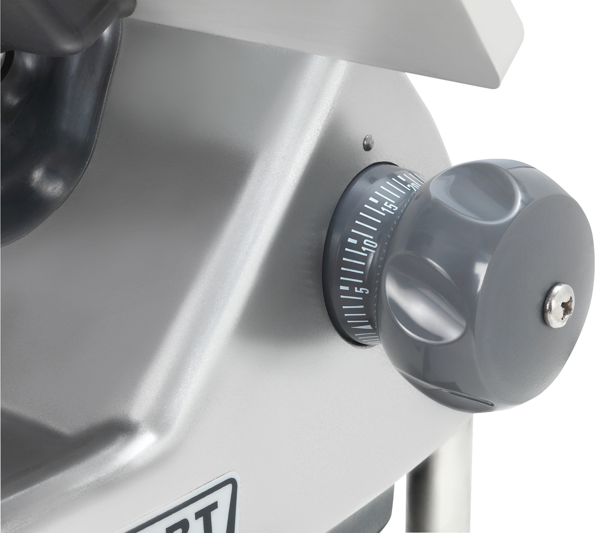 A close-up of a gray control knob with numbered markings from 0 to 15 on a heavy duty meat slicer. The ribbed knob, designed for grip, sits on the smooth, reflective surface near the 13 CleanCut knife of this metallic machine.