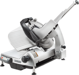 A heavy duty meat slicer with a silver metallic body, CleanCut knife, adjustable sliding food tray, control panel with buttons, and sturdy black feet. The Hobart brand is visible on the front. The automatic meat slicer is angled, ready for use.