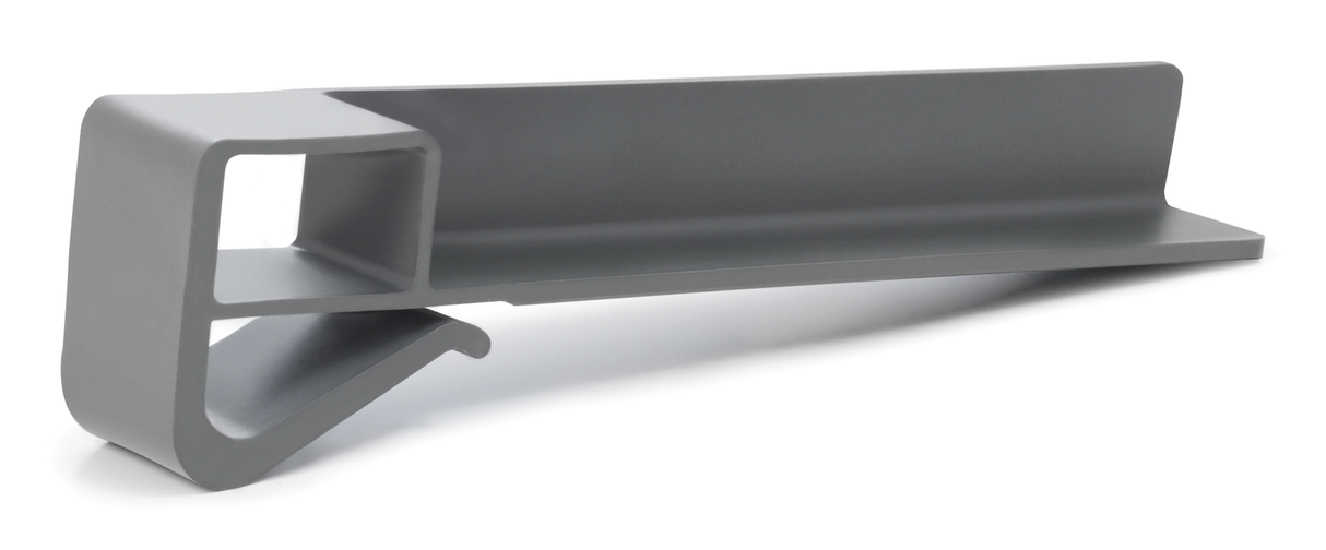 A gray, L-shaped plastic object with a hollow square section on one end and a curved hook extending from the base. This minimalist product fence is a functional, modern accessory—possibly a clip or holder for organizing items.