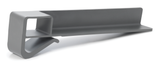 A gray, L-shaped plastic object with a hollow square section on one end and a curved hook extending from the base. This minimalist product fence is a functional, modern accessory—possibly a clip or holder for organizing items.