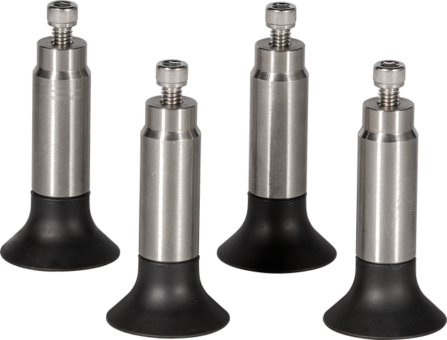 Four adjustable 4.5" legs with cylindrical stainless steel bodies and black rubber bases stand upright on a white background. Each leg, ideal for Hobart HS manual slicers, features a visible screw for height adjustment or attachment.