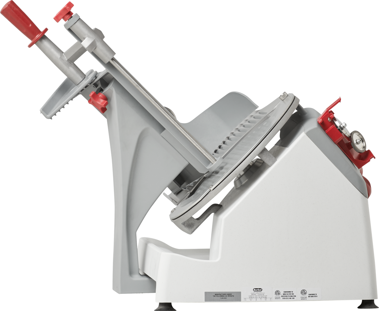 The Berkel X13-PLUS Premium Food Slicer is a commercial-grade, manual food slicer with a tilted gray and white body, circular cutting blade, sliding tray, and red handles for adjusting thickness and the safety guard—all shown on a plain white background.