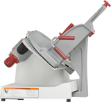 The Berkel X13-PLUS Premium Food Slicer boasts a white and gray body with red adjustment knobs, an angled food tray, and a serrated blade—this manual food slicer is perfect for slicing deli meats or cheeses. The base includes a visible caution label.