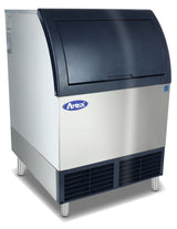 A commercial cube-style ice machine with a stainless steel body, black sloped top door, and four metal legs. Brand name “Atosa” is visible on the front above ventilation grills. Includes a convenient stainless steel ice bin for easy storage.