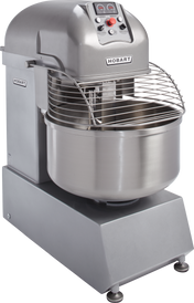A large, industrial stainless steel Hobart Spiral Mixer with a control panel on top, safety guard over the mixing bowl, spiral dough hook, and sturdy base. Designed for commercial kitchens or bakeries, it features a 220-pound capacity and sits on four metal feet.