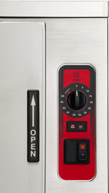 Close-up of a stainless steel ENERGY STAR steamer, featuring a timer dial set to 0–60 minutes, switches for “Low,” “High,” and “Cook,” and a vertical handle with a white arrow pointing up beside the word “OPEN.”.