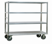 A Silver Transporter utility cart with an aluminum tubular frame, four large caster wheels, and four open shelves. The cart is empty and silver, photographed against a plain white background.