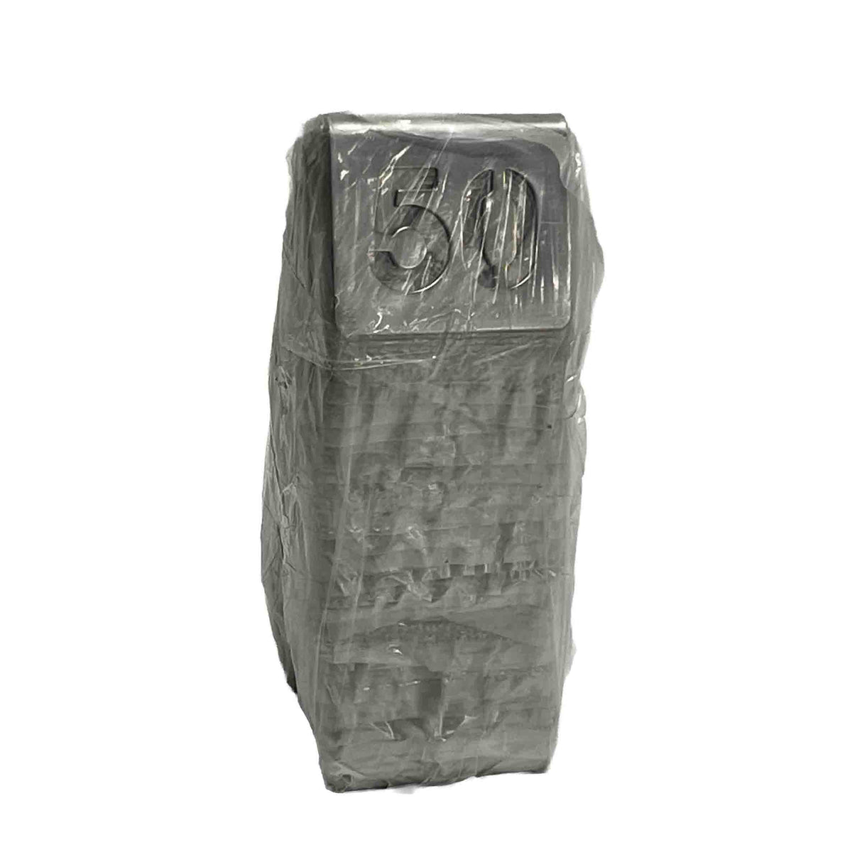 A stack of rectangular, gray TableCraft number tent set objects wrapped tightly in plastic, with 50 embossed on the visible top surface. The clear, crinkled wrapping reveals the stainless steel shapes and numbers beneath against a plain white background.