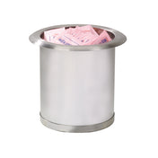 A round, stainless steel condiment holder is filled with multiple pink packets of artificial sweetener. The container features a wide, smooth rim and sits on a plain white background, with the packets stacked loosely inside.
