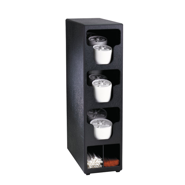 A black, vertical Dispense-Rite coffee cup dispenser with four slots holds stacks of white disposable cups and a lid organizer. The bottom section features compartments for coffee stirrers and napkins, organized horizontally against a plain white background.