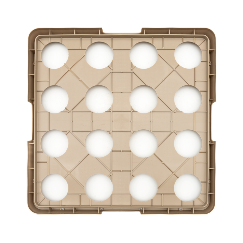 A beige Traex Rack-Master plastic tray holds sixteen white eggs in a neat 4x4 grid, viewed from above. The square warewashing rack features raised edges and geometric lines forming triangles between each egg compartment.