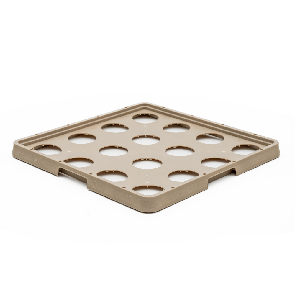 A square, tan plastic tray with raised edges and twelve large circular cutouts arranged in a grid pattern. This Traex Rack-Master warewashing rack is ideal for securely holding or organizing round items, such as ice filler containers, on a white background.