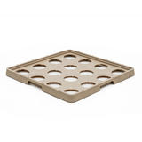 A square, tan plastic tray with raised edges and twelve large circular cutouts arranged in a grid pattern. This Traex Rack-Master warewashing rack is ideal for securely holding or organizing round items, such as ice filler containers, on a white background.