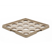 A square, tan plastic tray with raised edges and twelve large circular cutouts arranged in a grid pattern. This Traex Rack-Master warewashing rack is ideal for securely holding or organizing round items, such as ice filler containers, on a white background.