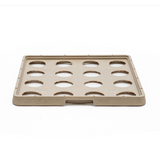 A beige rectangular plastic tray from the Traex Rack-Master line, featuring raised edges and fifteen evenly spaced circular cutouts arranged in three rows of five, ideal for use with warewashing racks. The tray has a small indented notch in the front edge.