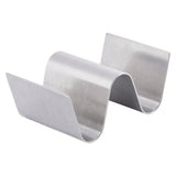 A stainless steel Taco Taxi Server with an S-shaped wave design, holding space for two tacos. The holder has a brushed metal finish, is dishwasher safe, and stands upright with curved slots to keep tacos separated and upright.