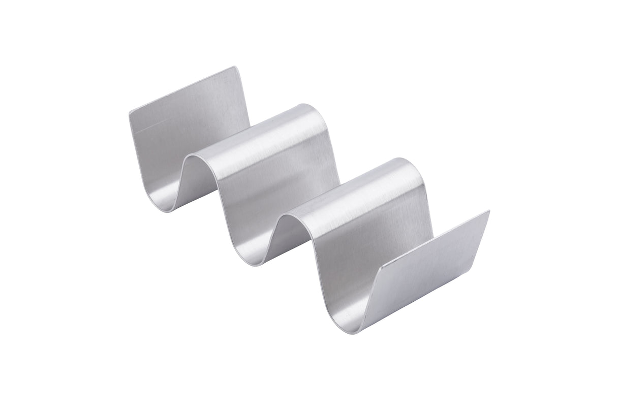 The Taco Taxi Server is a stainless steel holder with a wavy zigzag design, featuring three curved slots that holds 2-3 tacos upright. A plain white background highlights its metallic finish and sleek, modern look.