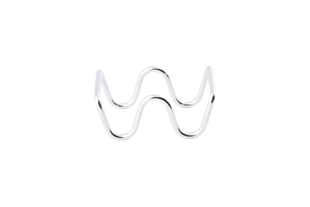 A shiny, stainless steel object forms a continuous zigzag shape with smooth curves, resembling the letter W. It stands upright on a plain white background with no other items visible.