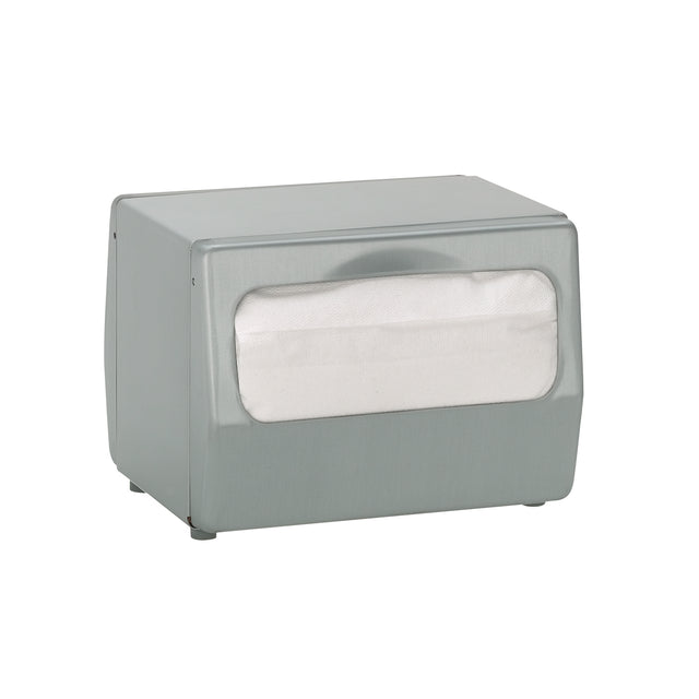 A rectangular tabletop napkin dispenser sits on a white background. It features a brushed silver finish and a front window displaying a stack of full fold napkins inside. The design is simple and utilitarian, ready for convenient use.
