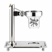 A polished metal citrus juicer by TableCraft stands on a rectangular base with rounded feet. It features a vertical column, a funnel-shaped juicing cup, a paddle handle, and a spout below. The design is modern and shiny with clean, reflective surfaces.