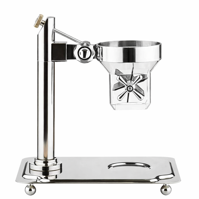 A polished metal citrus juicer by TableCraft stands on a rectangular base with rounded feet. It features a vertical column, a funnel-shaped juicing cup, a paddle handle, and a spout below. The design is modern and shiny with clean, reflective surfaces.