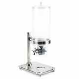 A tall, cylindrical TableCraft cereal dispenser with a transparent body and stainless steel base. It features a spigot for dispensing liquids or grains, a removable lid, and small feet for stability, offering a sleek, modern appearance.