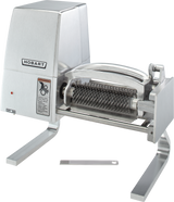 A stainless steel Hobart 403-20 meat tenderizer with an electric motor housing on the left, visible rotating blade rollers, and sturdy legs for stability. Features Export Configuration and supports 220-240 Voltage. A metal cleaning comb tool is in front.