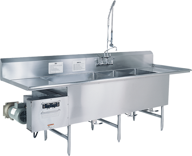 A large commercial stainless steel sink with four deep basins, a tall backsplash, an industrial TurboWash faucet with a flexible hose, and a mounted garbage disposal unit on the left side, supported by metal legs.