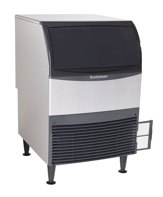 A silver and black Scotsman undercounter ice maker with a closed top lid and vented front panel stands on four legs. A small side access panel is open, revealing part of the high capacity ice machine’s interior mechanism.