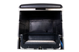 A front-facing view of an empty undercounter ice maker machine. The clean, black interior features a lower ice bin storage and a grid for collecting cube style ice. The sleek silver and black exterior contrasts with the plain white background.