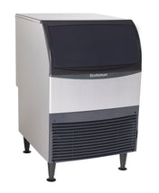A freestanding Scotsman undercounter ice maker with a stainless steel body, black door, and black vented grille at the bottom front. The unit stands on four black legs and is designed for commercial use.