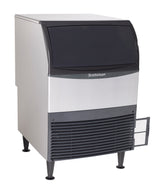A commercial Scotsman undercounter ice maker with a silver body, black front panel, vented lower section, and sturdy legs. The rectangular appliance features a lift-up door and a small open access panel on the bottom right corner.