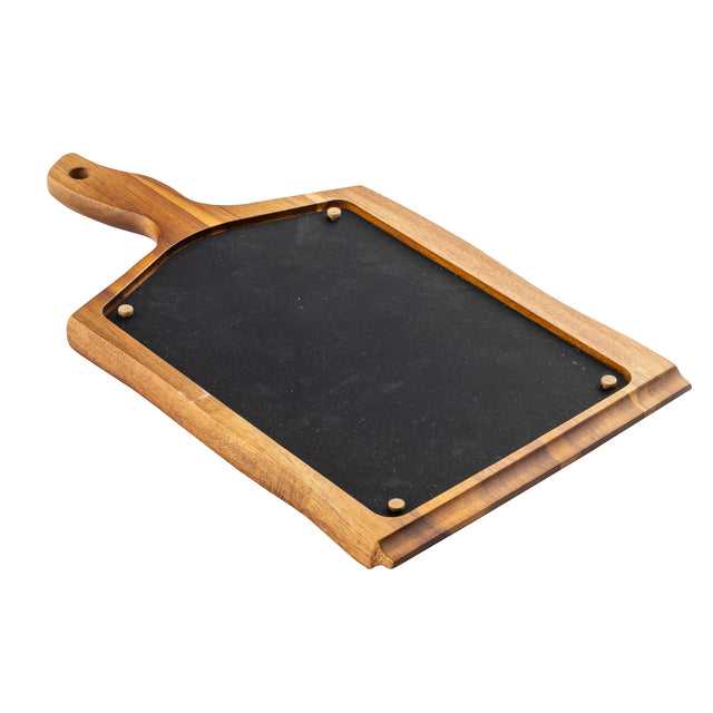 A rectangular wood serving tray with a handle, featuring a black slate center secured by four small round fasteners at each corner. The polished wood has a smooth finish, and the slate surface appears clean and slightly textured.