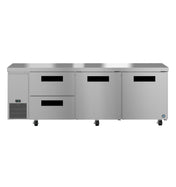 A commercial undercounter refrigerator featuring two pull-out drawers on the left, two large reach-in swing doors on the right, a ventilation grate below, and four caster wheels for mobility. Its sleek, stainless steel design is both practical and industrial.