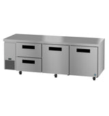 A commercial stainless steel undercounter refrigerator with a flat top, two pull-out drawers on the left, and two swing door compartments on the right. This reach-in unit sits on wheels and features a small control panel near the bottom left.