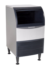 An ADA compliant commercial Scotsman undercounter ice maker with a silver and black exterior, front panel vents at the bottom, and an open black dispensing area at the top; supported by four black legs.